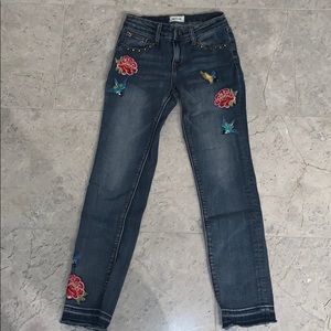 jeans with floral prints on them